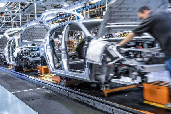 cars being built on a manufacturing line